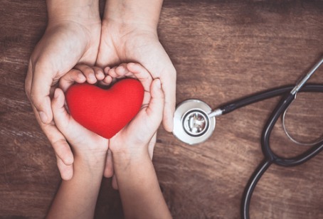 Hands holding a heart, representing Integrative Medicine Clarendon Hills IL